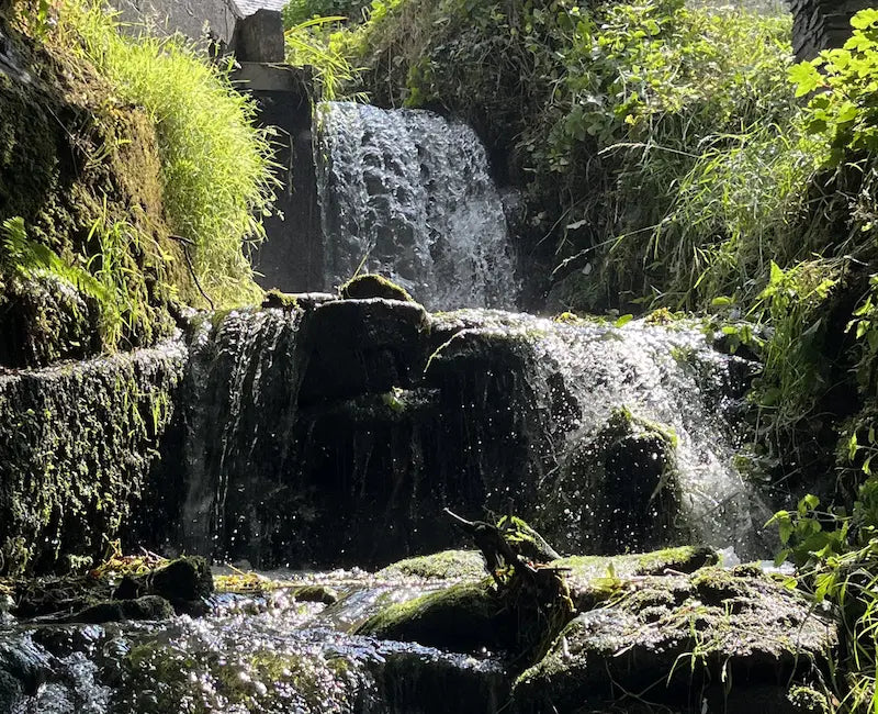 The Mill Race mini waterfall channel flowing down over rocks