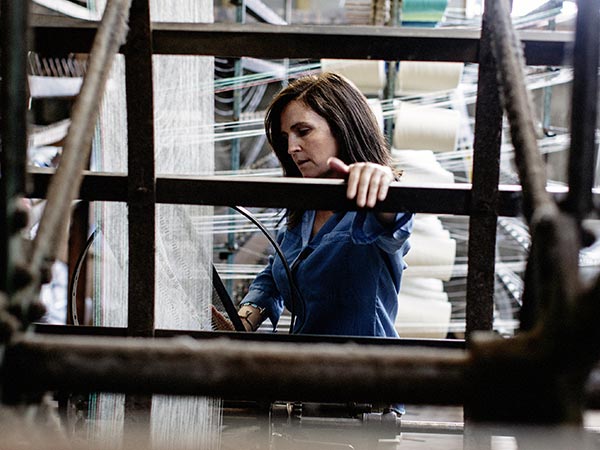 Portrait of Miriam Cushen working at the mill